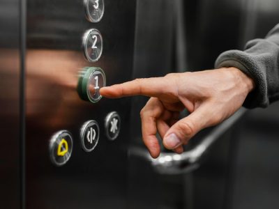 delivery-man-with-package-elevator-close-up